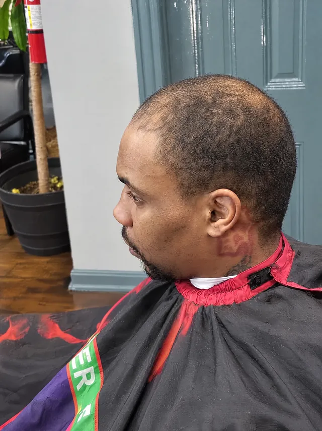 Close-cropped haircut before